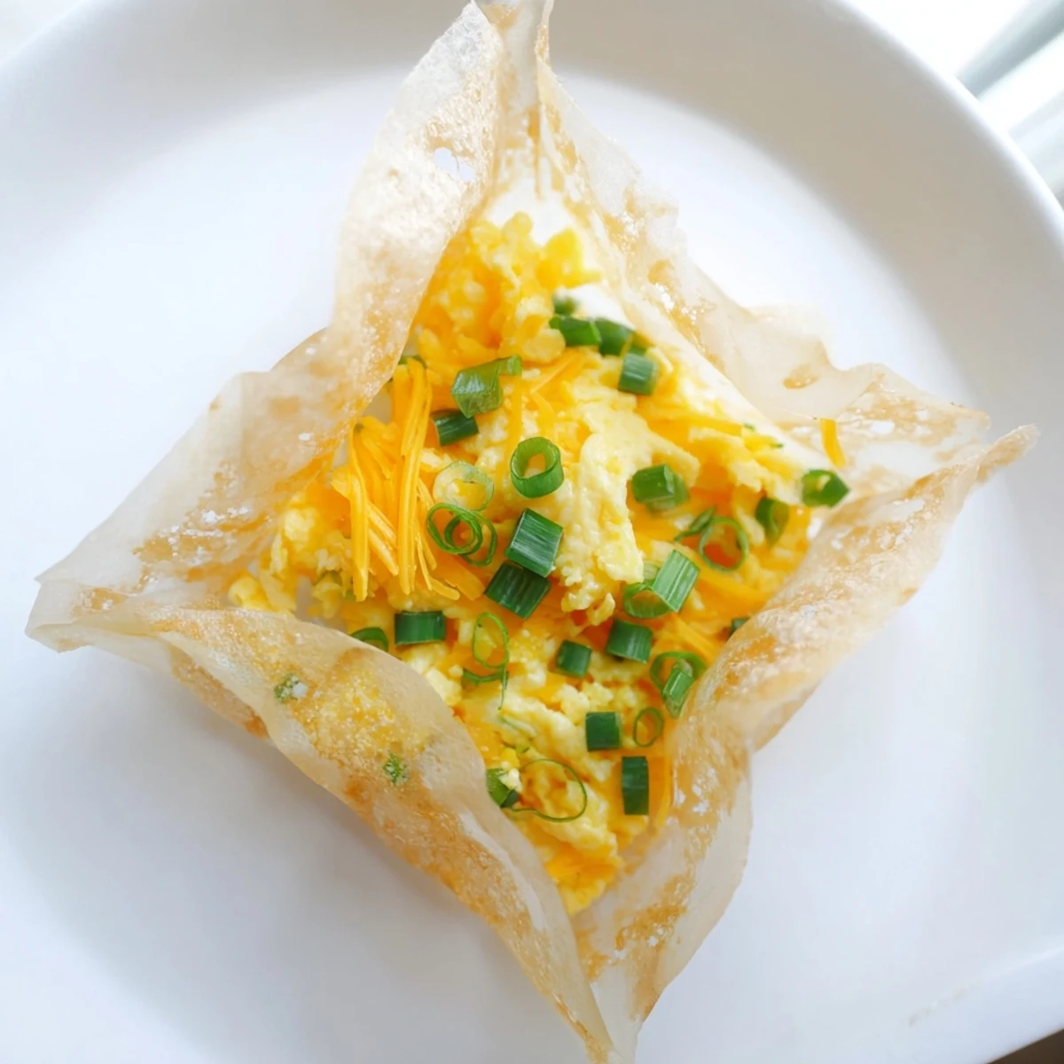 Golden, crispy Rice Paper Egg & Cheese Fold: a delicious, savory snack with melted cheese and scallions.