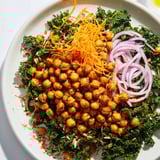 This Kale Salad with Roasted Chickpeas features vibrant green kale with crunchy, spiced chickpeas and a tangy dressing.
