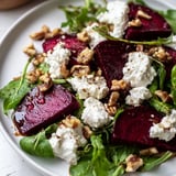 Close-up of a colorful beet and goat cheese salad, showcasing fresh ingredients and flavors.