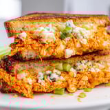 Crispy, golden-brown Buffalo Chicken Grilled Cheese sliced, ready to enjoy for lunch or dinner.