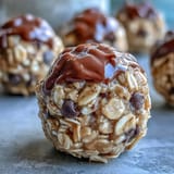 Wholesome peanut butter oat bites with honey, chocolate chips, and coconut, rolled into perfect snack-sized balls for on-the-go energy.  