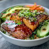 Colorful 15-minute teriyaki salmon bowl with vibrant vegetables, sesame seeds, and a glossy, savory-sweet glaze.