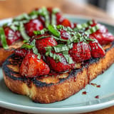 Vibrant strawberry balsamic bruschetta bursts with flavor atop grilled sourdough.