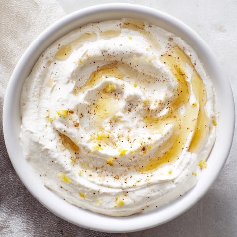 Creamy Greek Yogurt Fruit Dip, beautifully presented with vibrant berries and sliced apples for dipping.