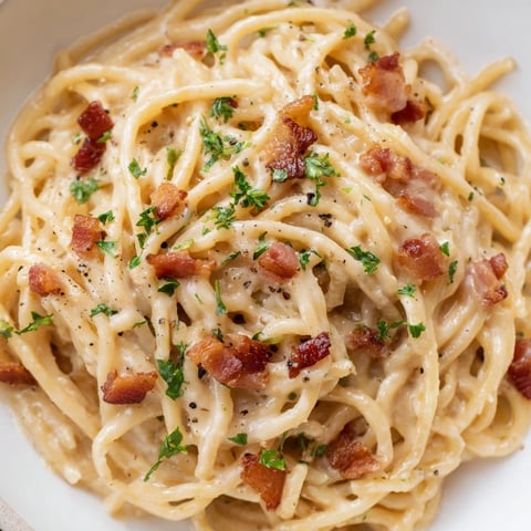 Ramen Carbonara Hack: Creamy noodles coated in rich egg and cheese sauce, a quick, easy comfort food.