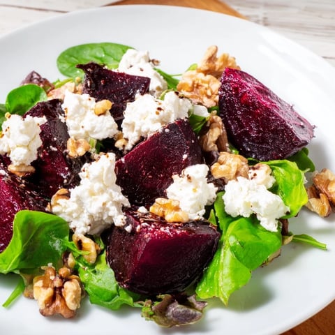 Roasted beet and goat cheese salad with vibrant red beets and creamy cheese, ready to eat!