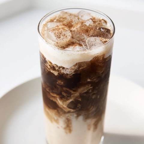 Creamy, refreshing Proffee Power Blend with ice, offering a delightful iced coffee taste and protein boost.