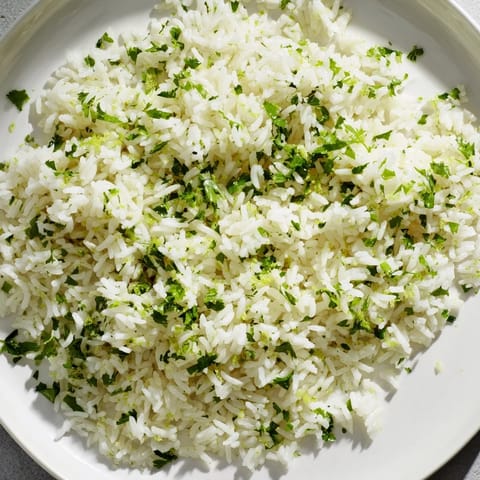 Fragrant and zesty, this cilantro lime rice features lime zest and fresh chopped cilantro garnish.