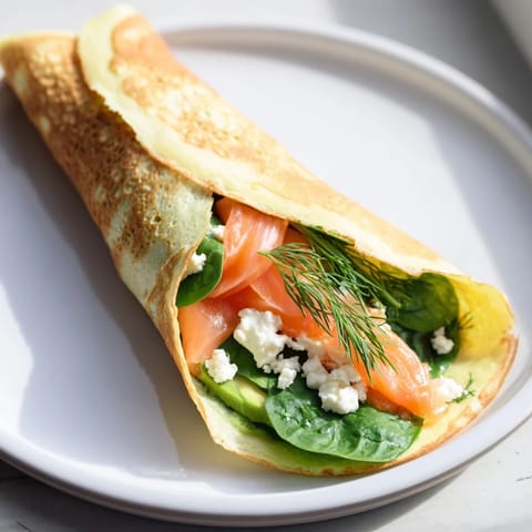 A delightful view of a freshly made blender egg crepe wrap, filled with colorful ingredients, ready to eat!
