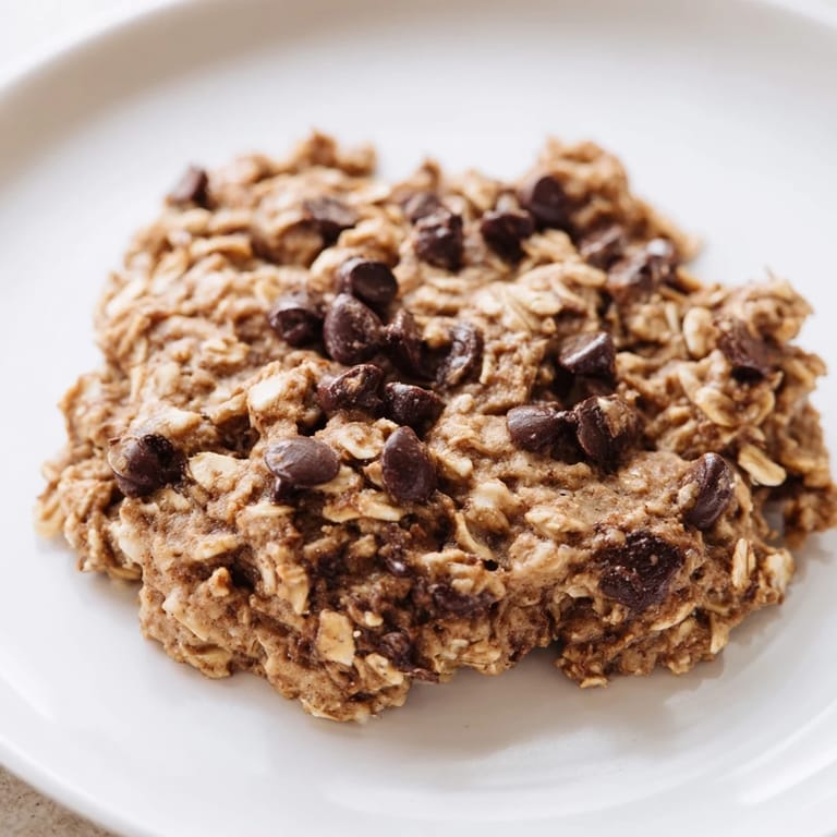 Golden-brown chocolate oatmeal breakfast cookies, fresh from the oven, offering a perfect, comforting morning treat.