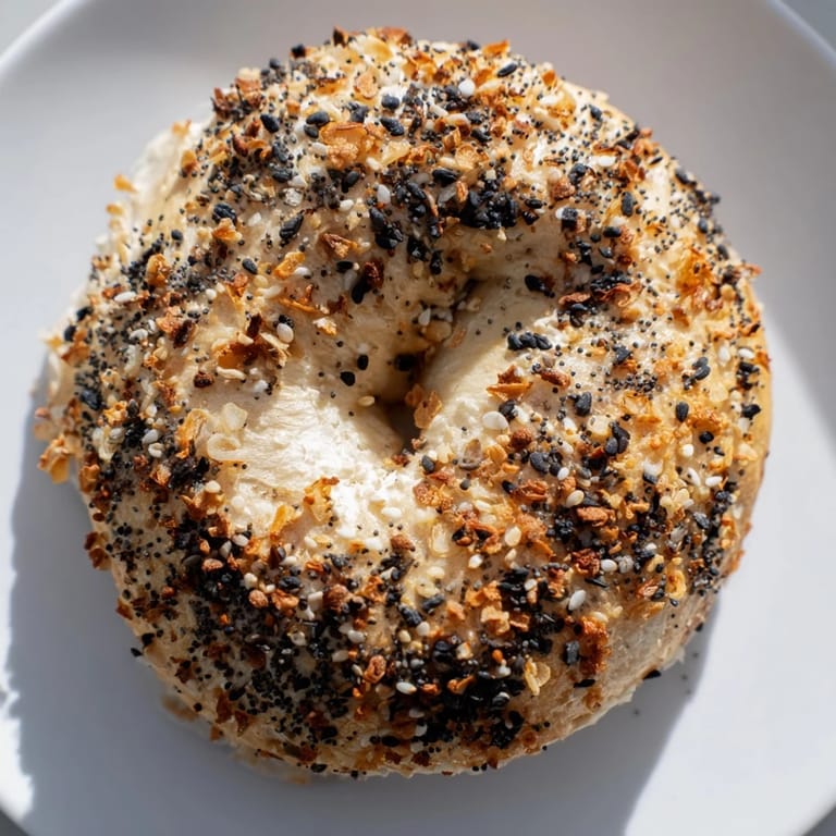 A close-up of delicious Everything Bagel Yogurt Bagels, showing the golden crust and enticing seasoning.