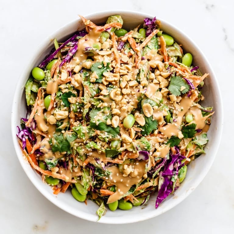 Vibrant Crunchy Thai Peanut Salad tossed with crisp veggies and a tangy peanut dressing, ready to enjoy as a refreshing side or light meal.