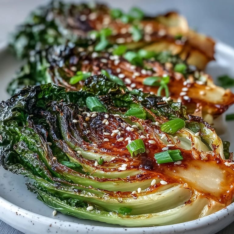 Restaurant-style Miso Butter Roasted Cabbage Wedges plated with a drizzle of extra sauce.